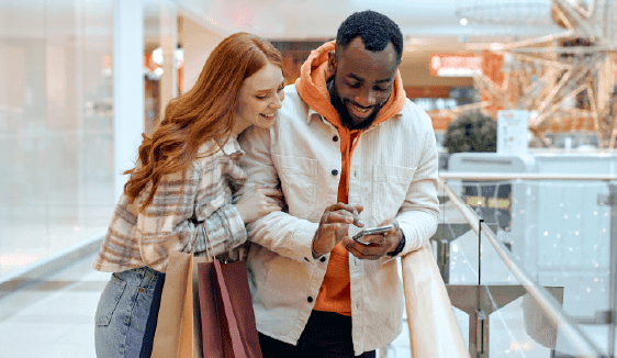 Image of a shopper receiving a localized offer on their phone